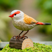 Wildlife Garden wood-carved bird - black-and-white firebird